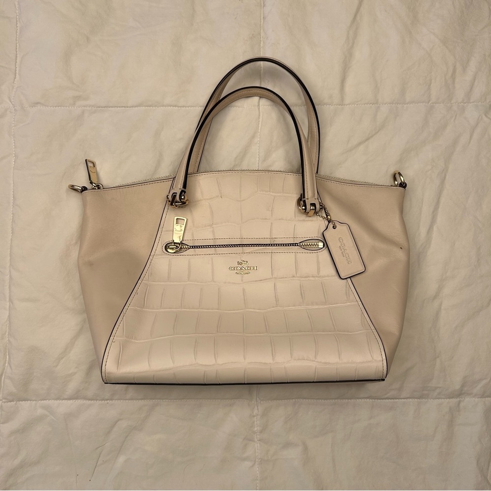 Medium cream Coach handbag.